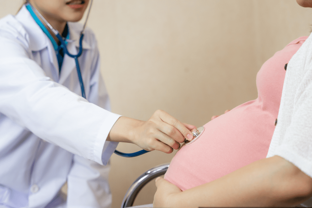 happy pregnant woman visits gynecologist doctor hospital