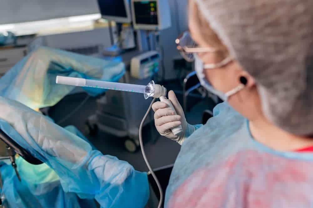 professional surgeon proctologist before operation holding special devices colonoscopy operating room hospital urgent surgical concept